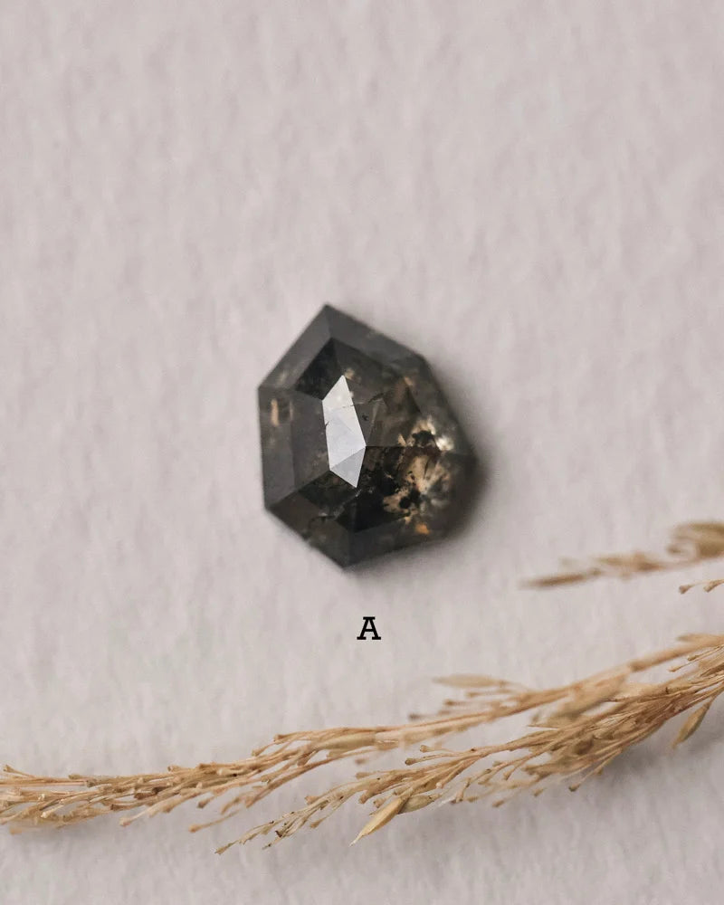 Loose dark grey rose-cut heptagon diamond option A for trilogy ring