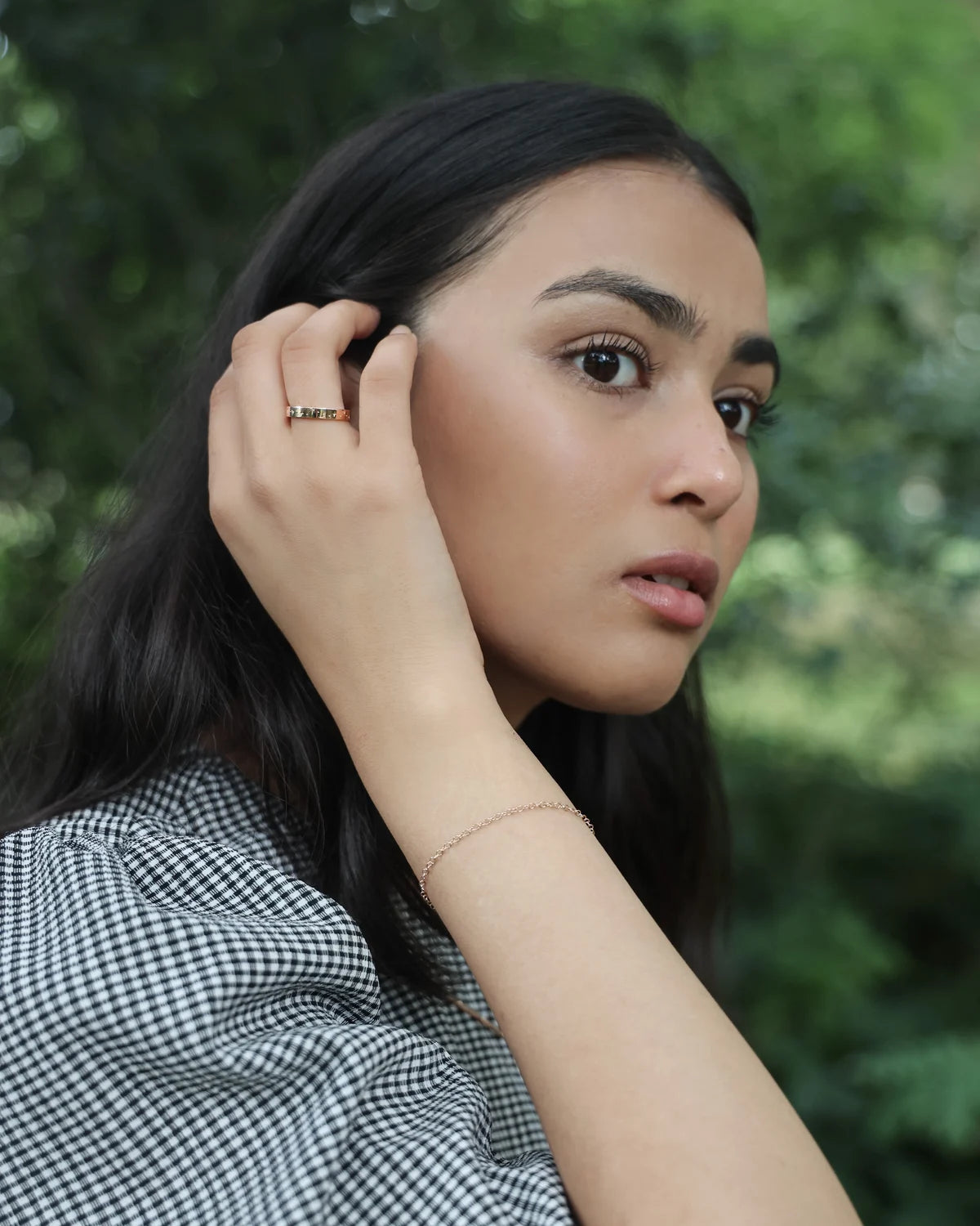 18ct yellow gold star set diamond ring worn in editorial portrait
