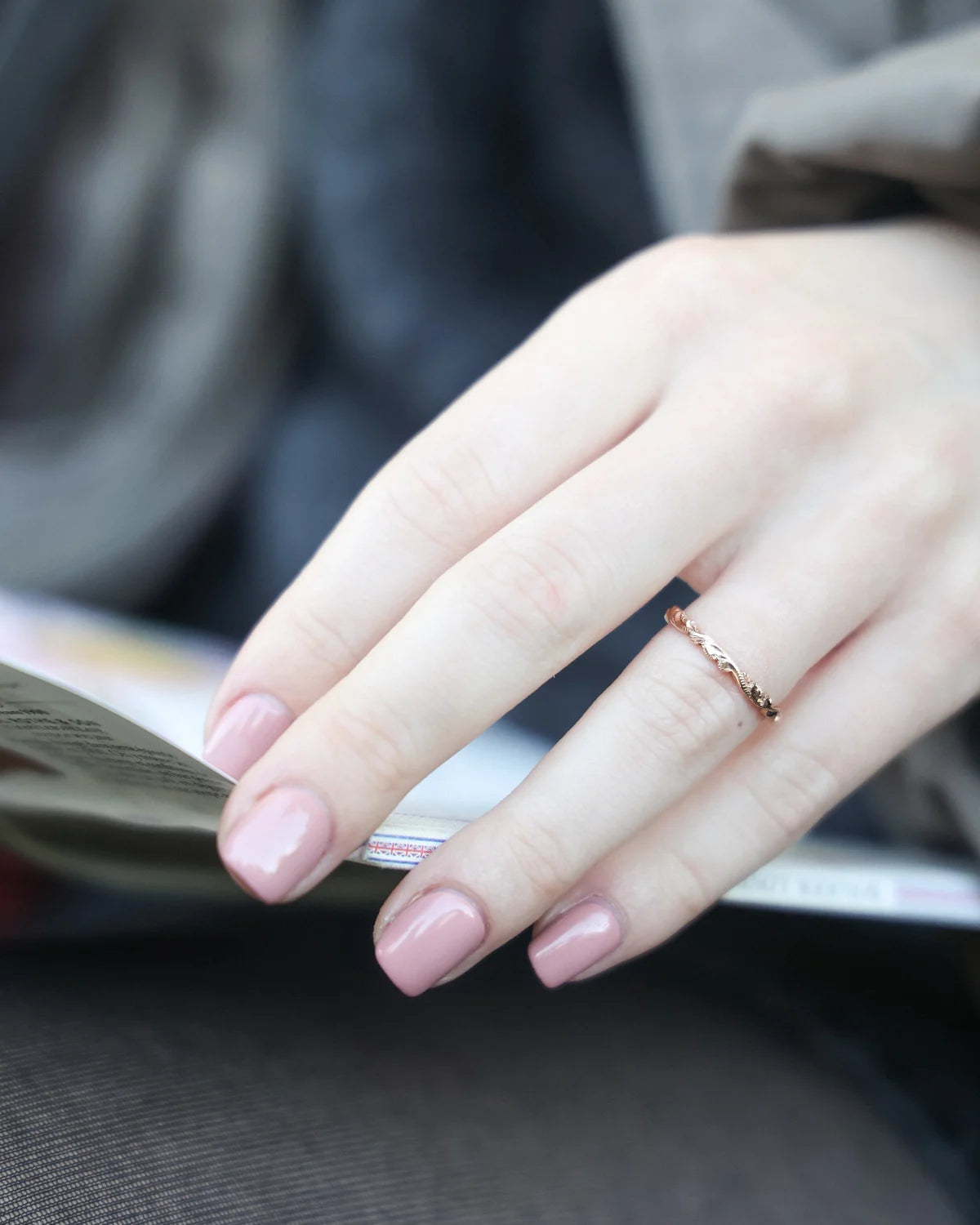 rose gold wedding ring worn on hand engraved floral band