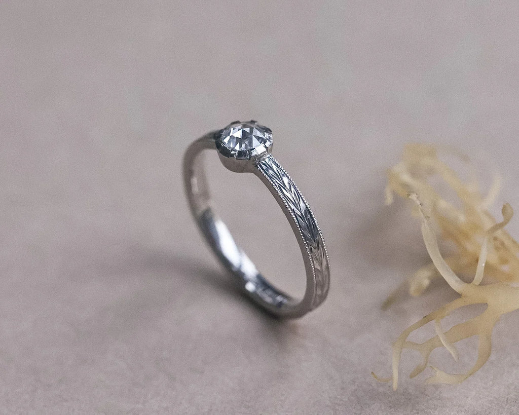 Side profile of a platinum rose-cut diamond solitaire ring