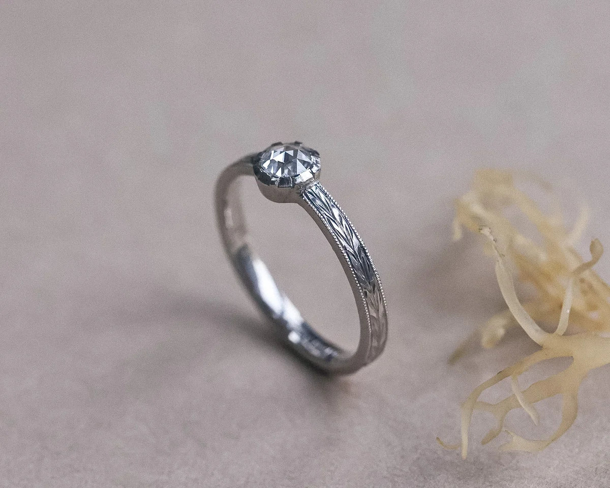 Side profile of a platinum rose-cut diamond solitaire ring