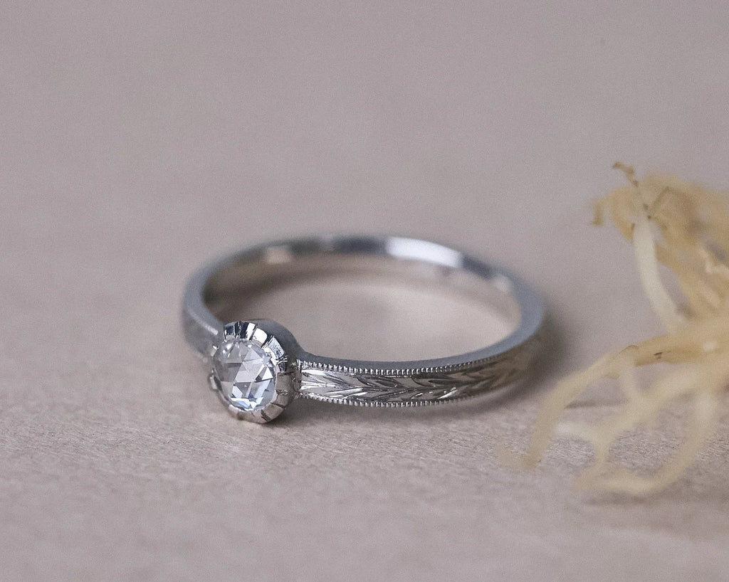 Botanical engraved platinum ring with rose-cut white diamond