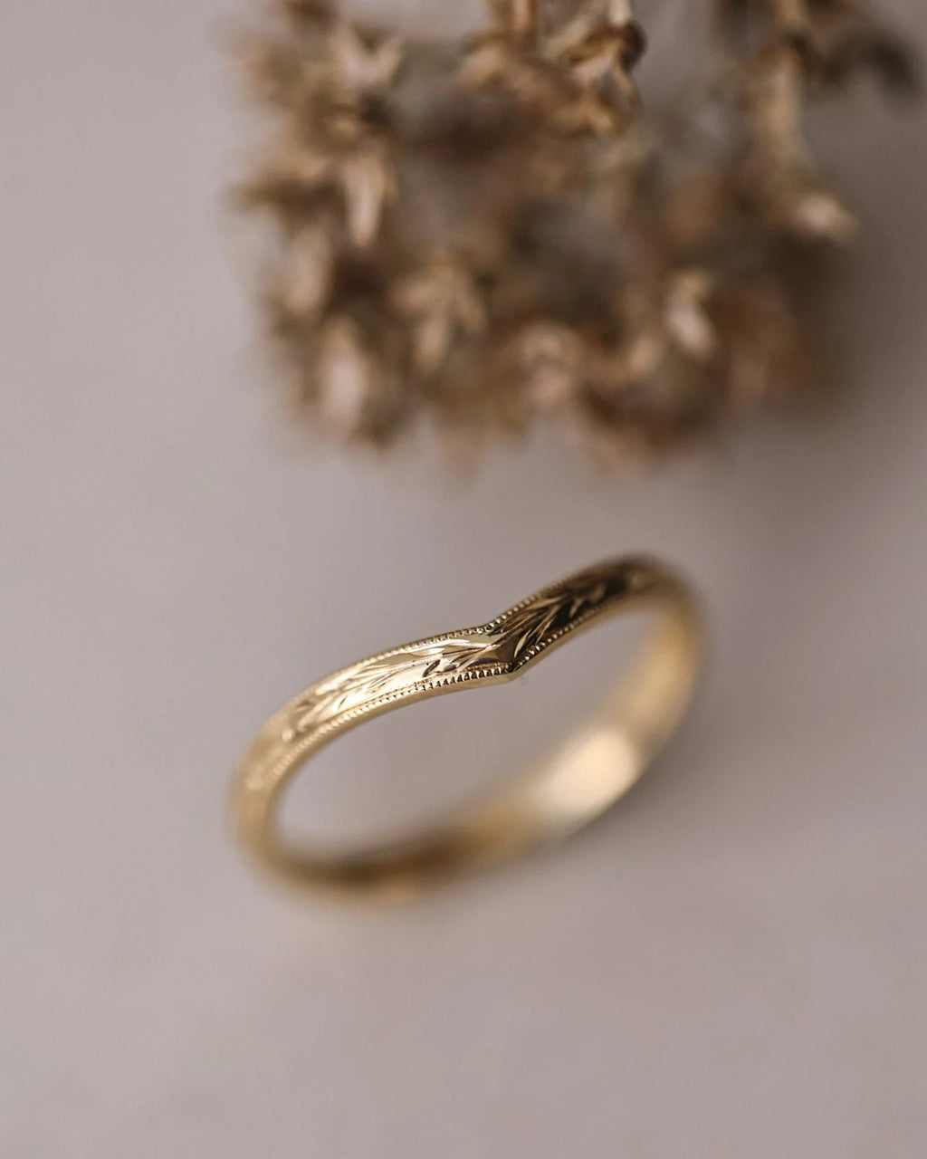 Vertical view of 18ct yellow gold olive leaf wishbone wedding ring