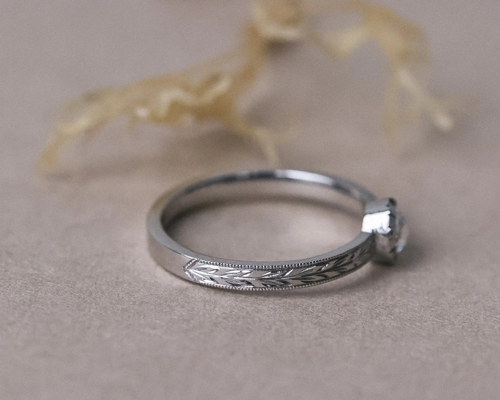 Side profile of a platinum rose-cut diamond solitaire ring