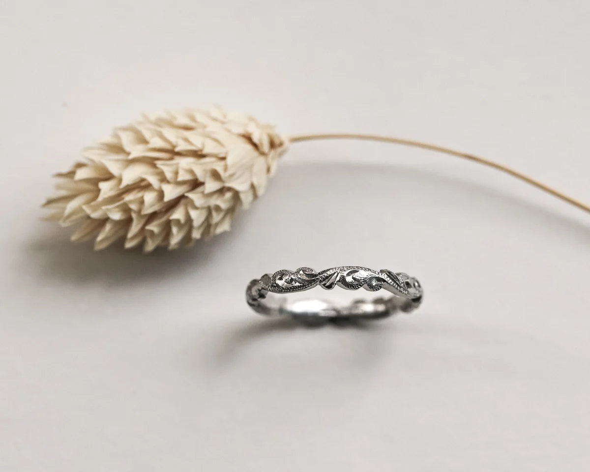 Minimal platinum floral carved wedding ring with dried flower detail