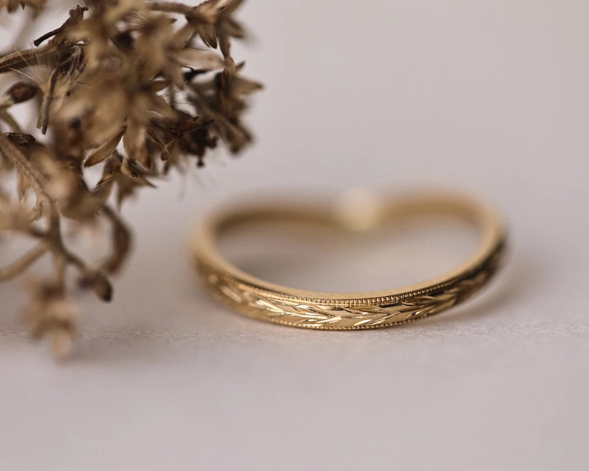 Back view of yellow gold olive leaf engraved wishbone ring