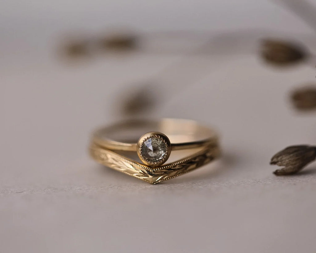 Olive leaf wishbone ring stacked with rose-cut diamond engagement ring