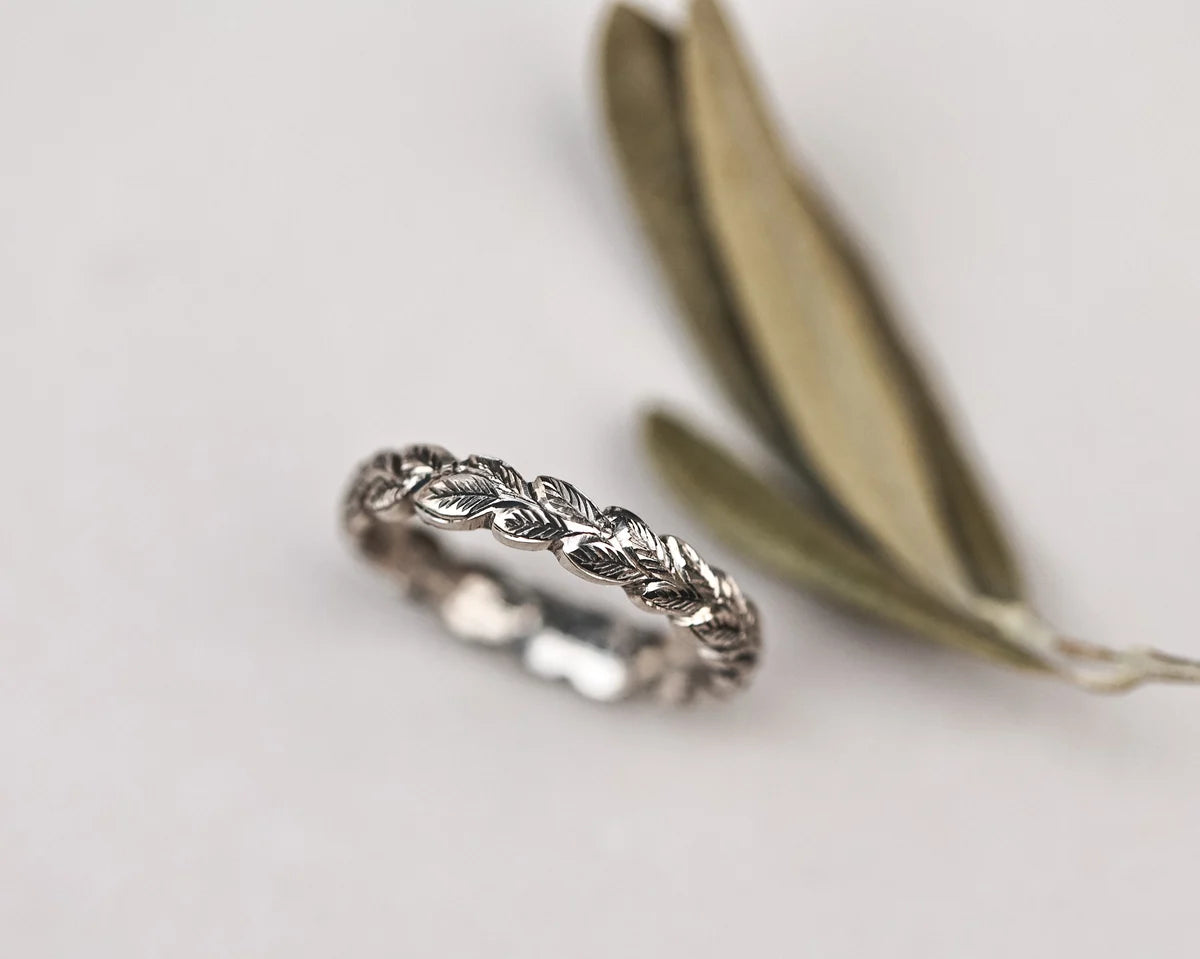 detailed leaf pattern engraving on 18ct white gold wedding band