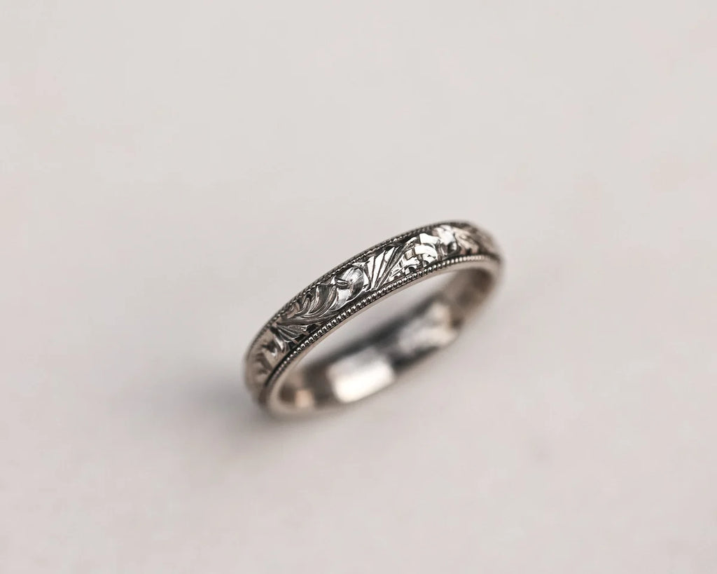Minimal 18ct white gold wedding band with floral engraving