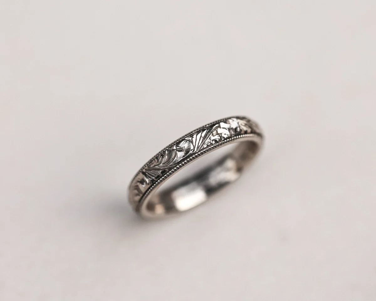 Minimal 18ct white gold wedding band with floral engraving