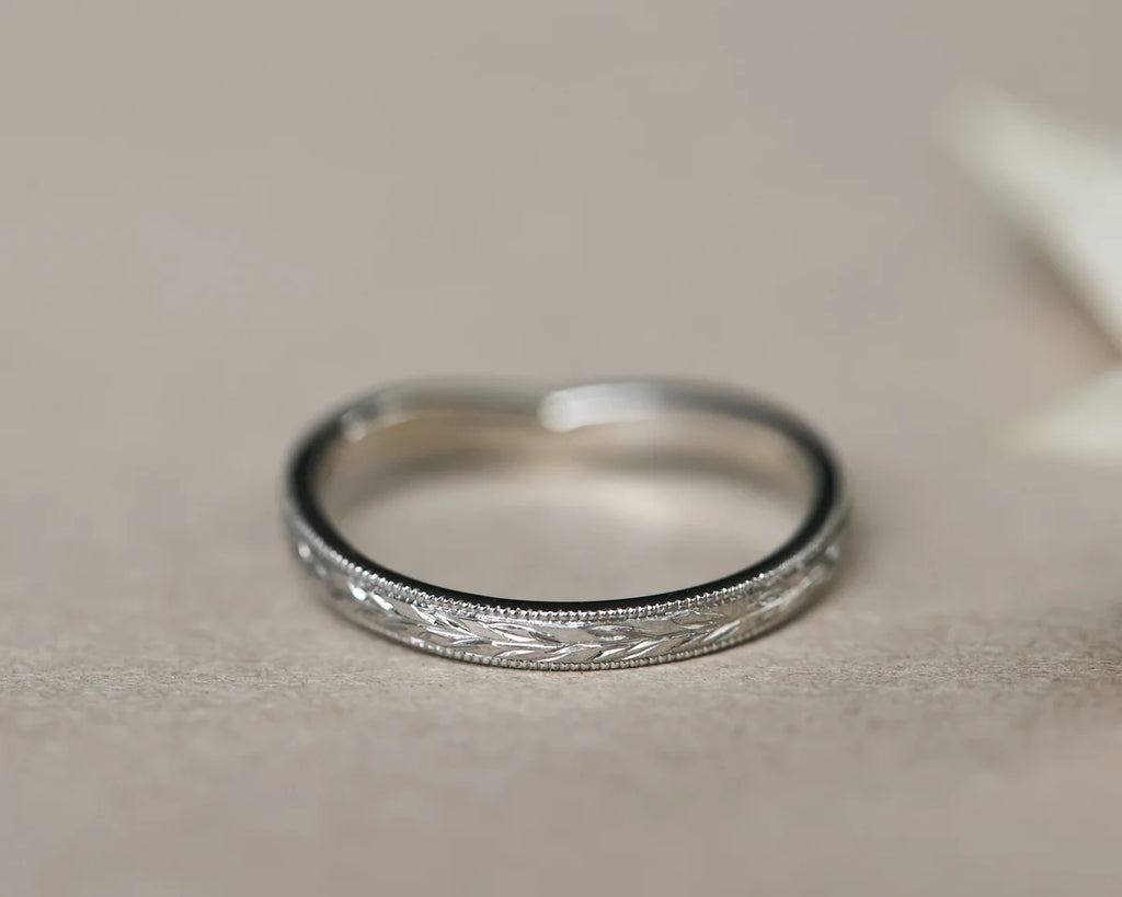  Minimal platinum olive leaf wishbone ring in soft natural light