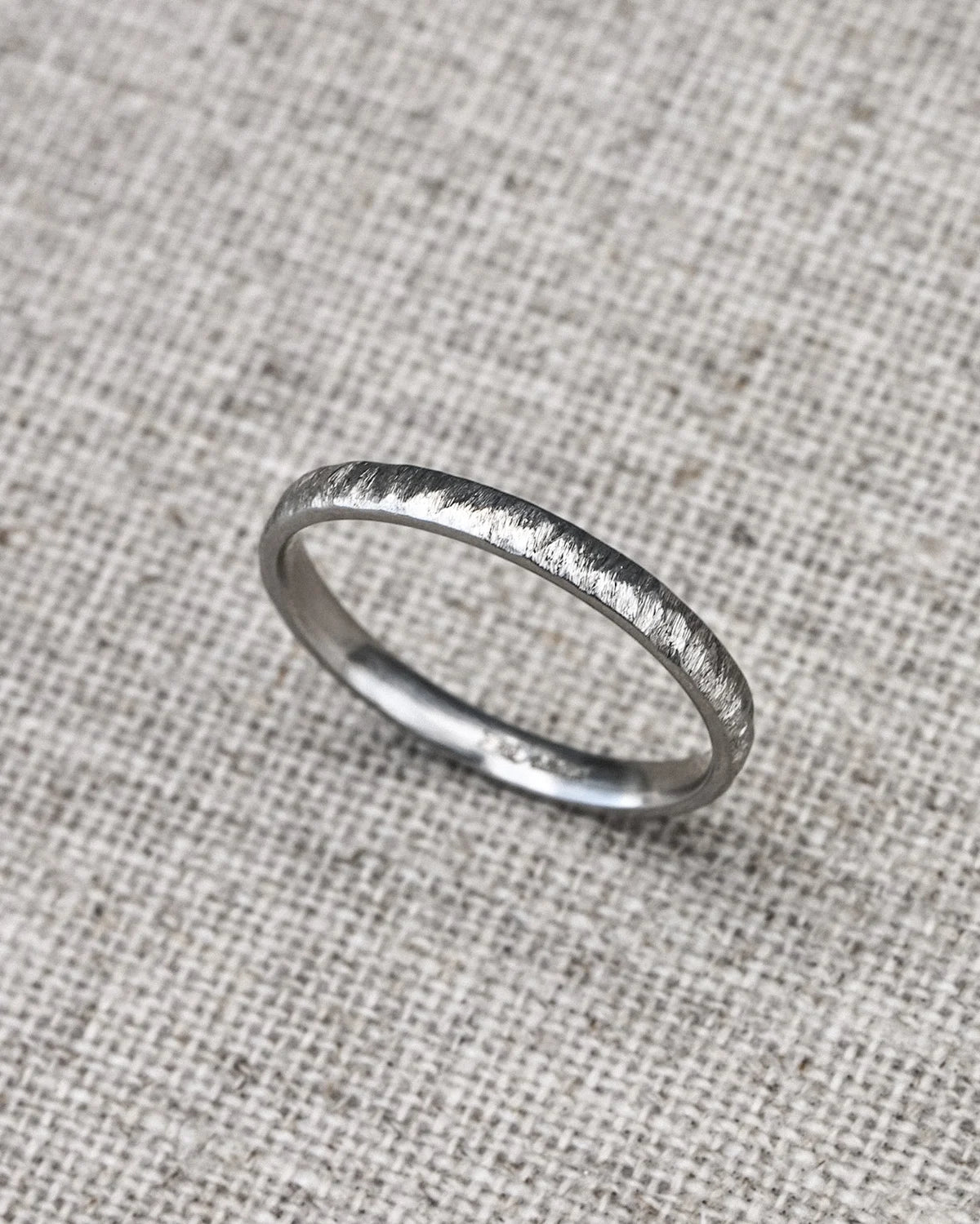 organic platinum wedding band horn texture minimalist design