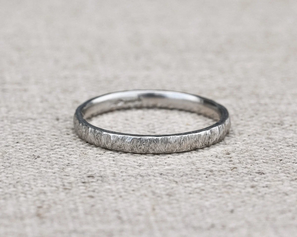 natural texture detail platinum wedding band close up