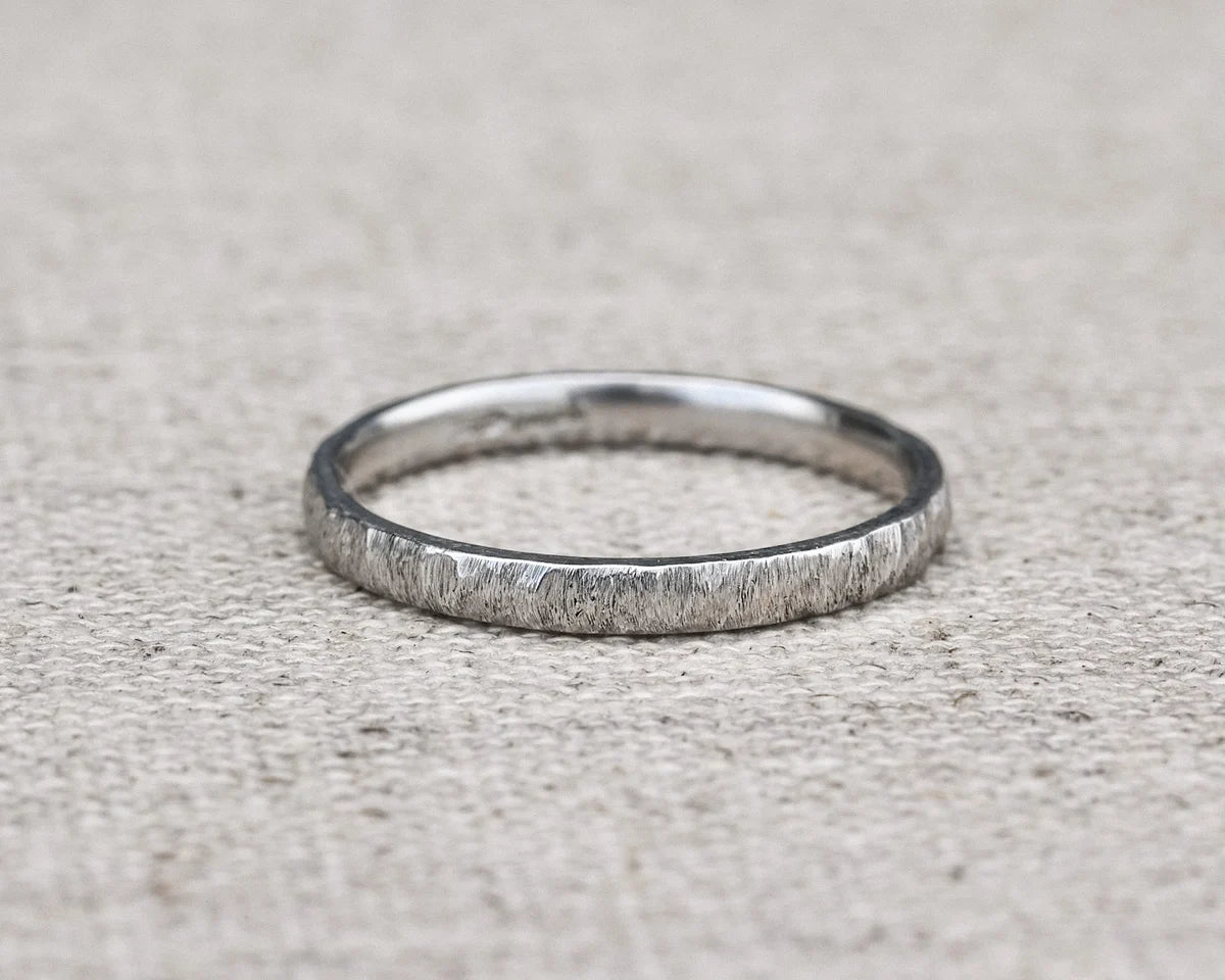 natural texture detail platinum wedding band close up