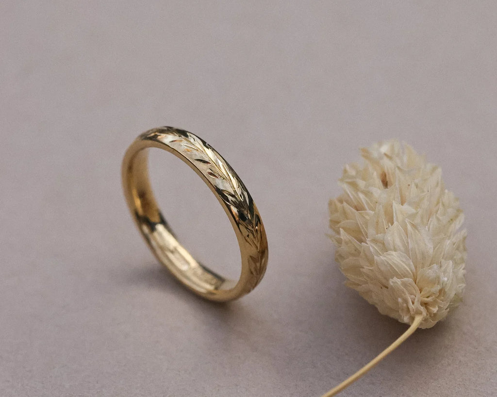 Side view of handmade olive leaf ring in 18ct yellow gold