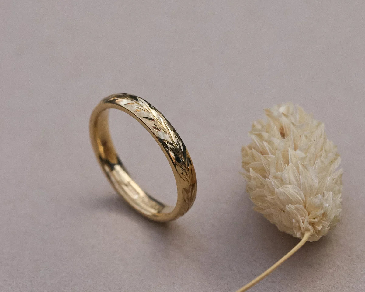 Side view of handmade olive leaf ring in 18ct yellow gold
