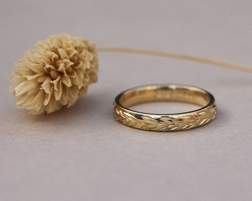 Low front view of 3mm olive leaf engraved wedding ring