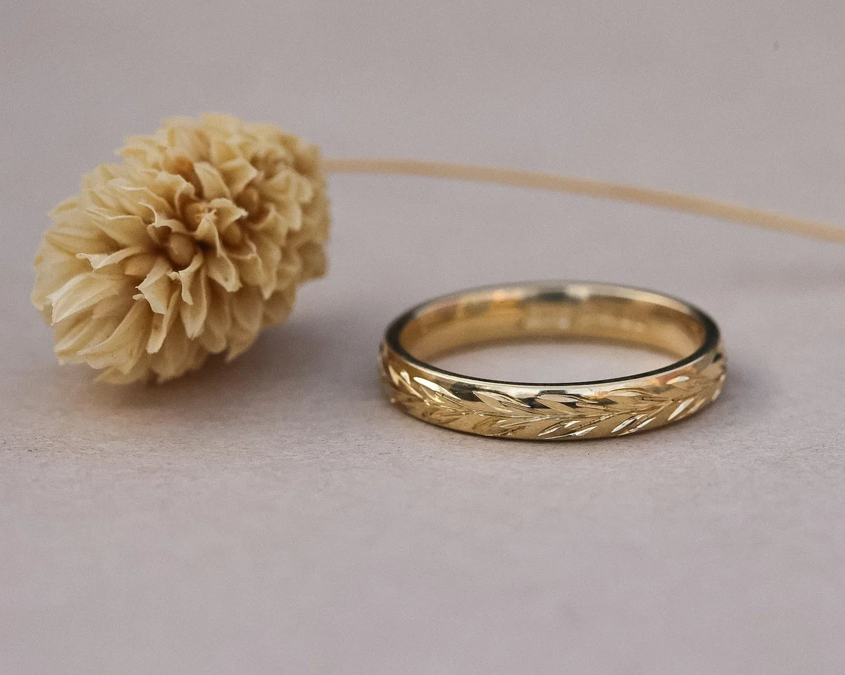 Low front view of 3mm olive leaf engraved wedding ring