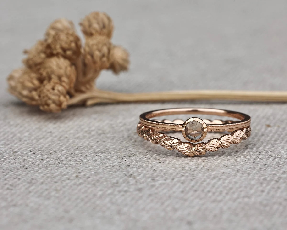 rose gold wishbone ring laurel leaf engraving milled edge champagne diamond close up