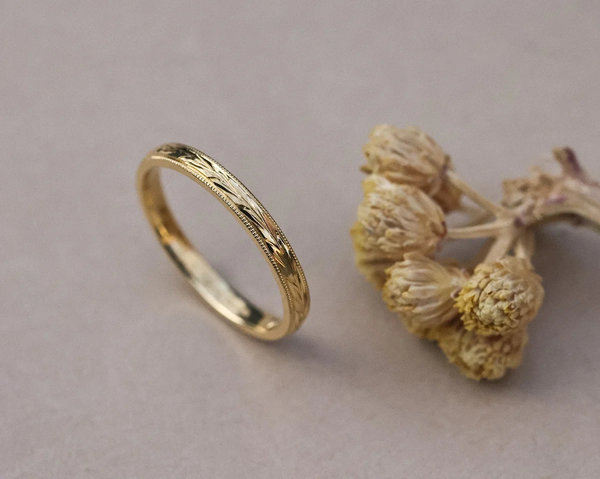 Side profile of 2mm olive leaf and milled edge wedding ring