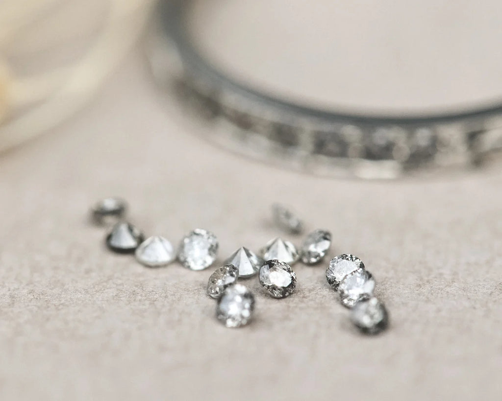  diamonds gemstones on a neutral background