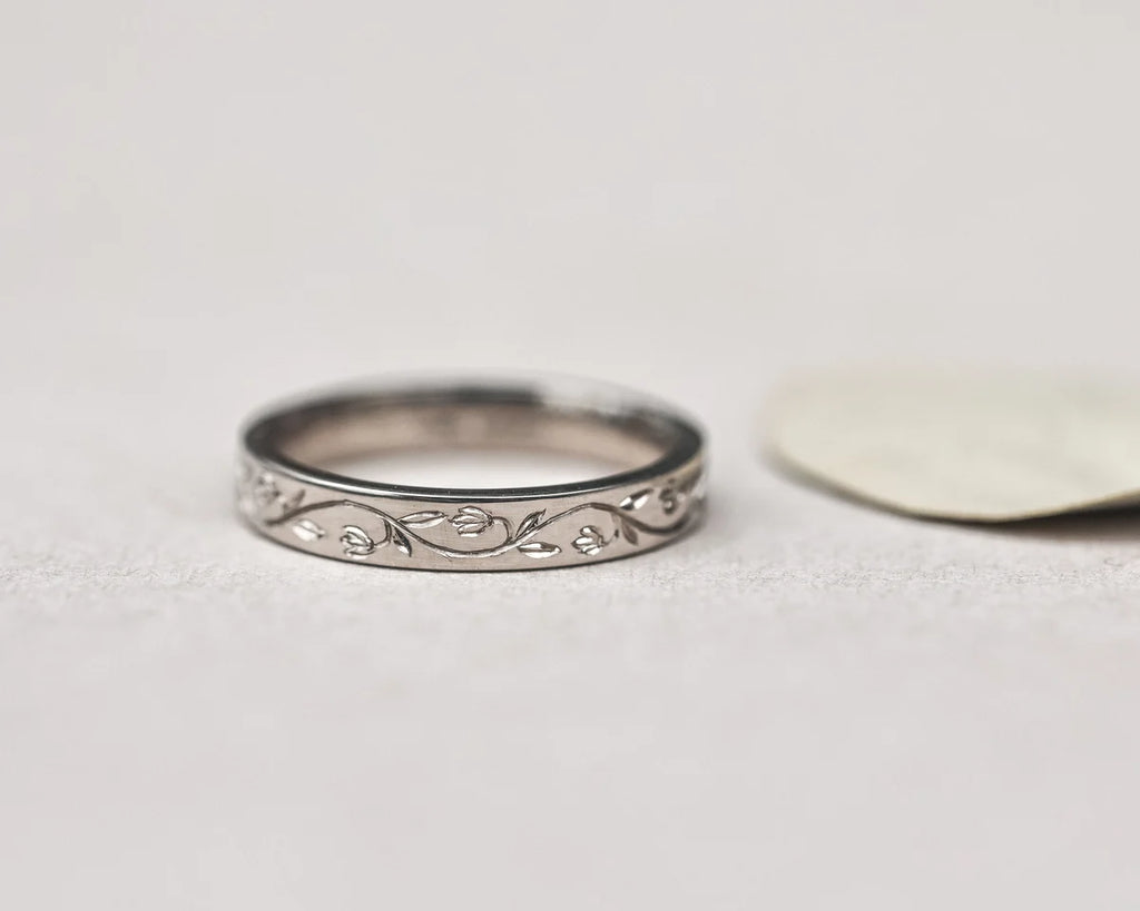 engraved snowdrop pattern detail wedding band