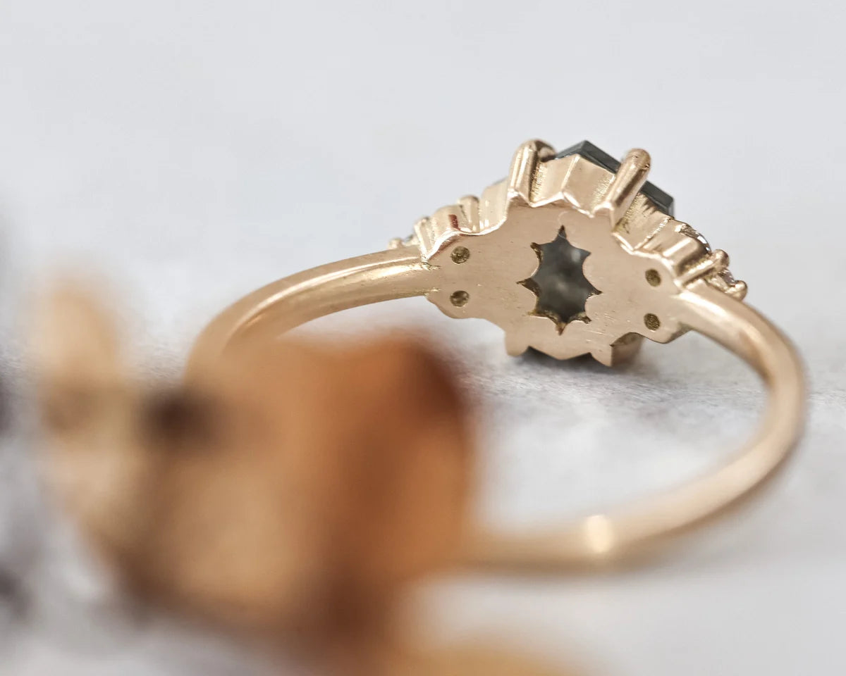 Back view of hexagonal diamond ring with plain yellow gold band