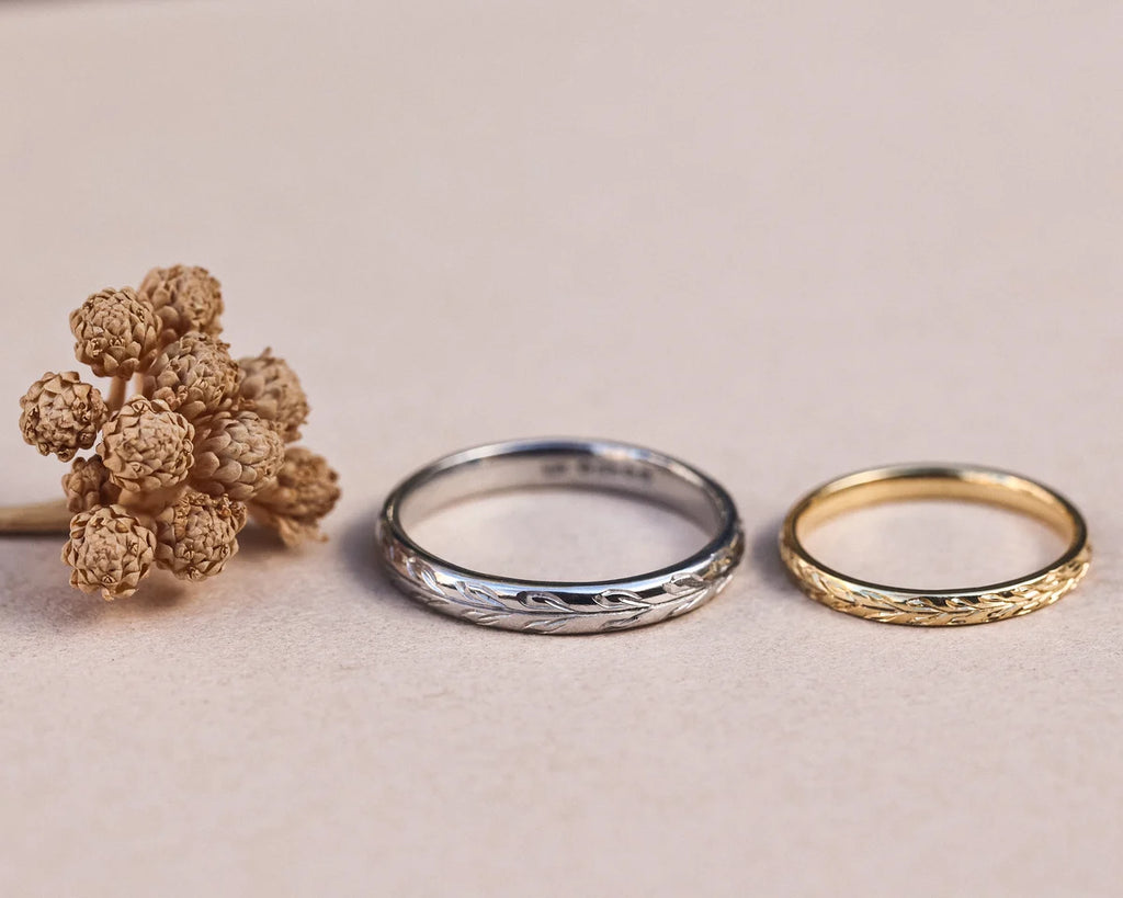 Matching olive leaf wedding rings in platinum and yellow gold