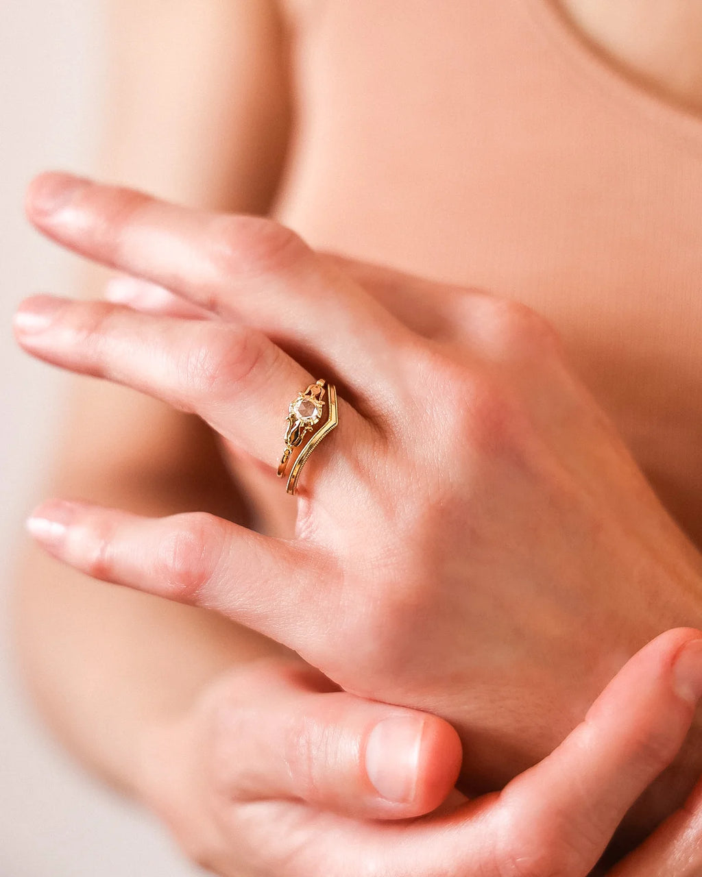 Rose-cut diamond ring worn on hand with warm editorial styling