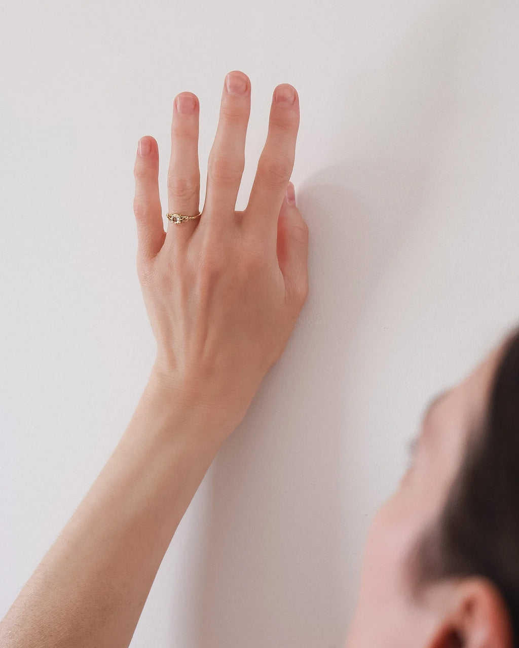 Woman wearing the rose-cut diamond ring in natural light
