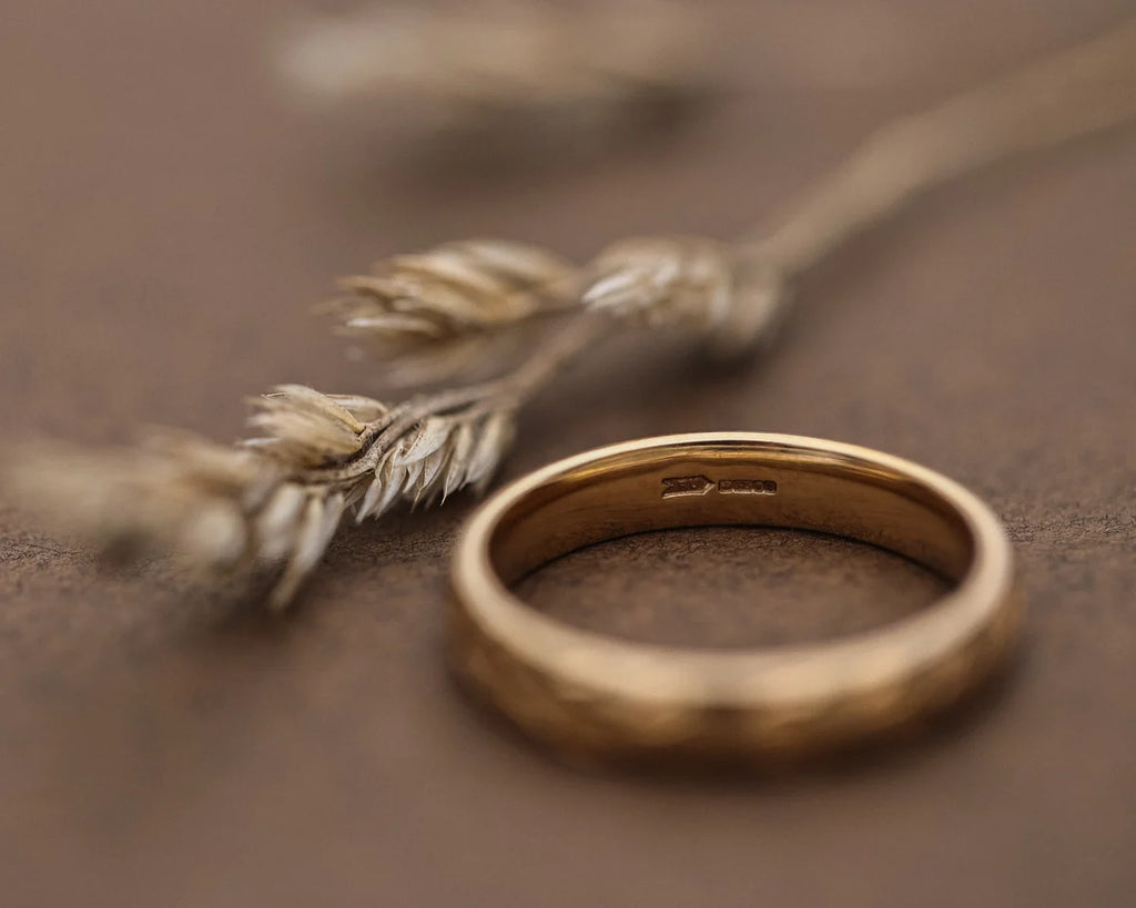 Back view of 9ct yellow gold court ring showing smooth interior