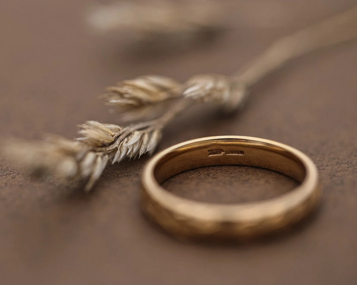 Back view of 9ct yellow gold court ring showing smooth interior