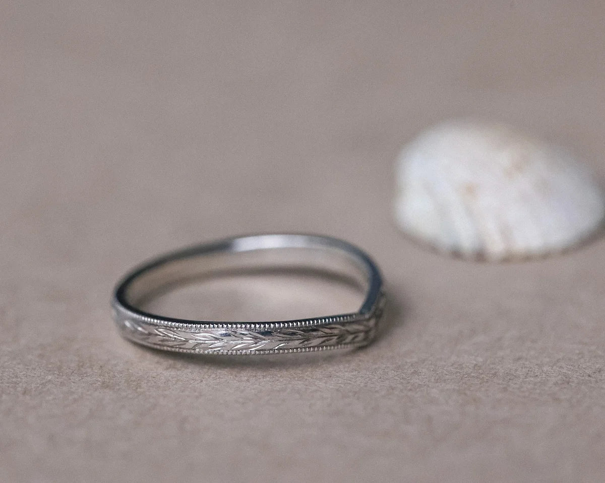 Front view of platinum olive leaf wishbone ring with fine milled edge