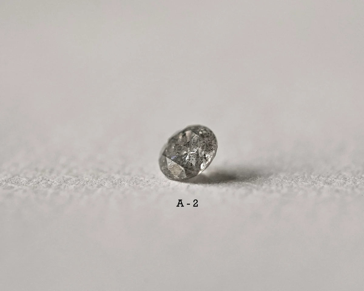 Raw diamond on a light gray background
