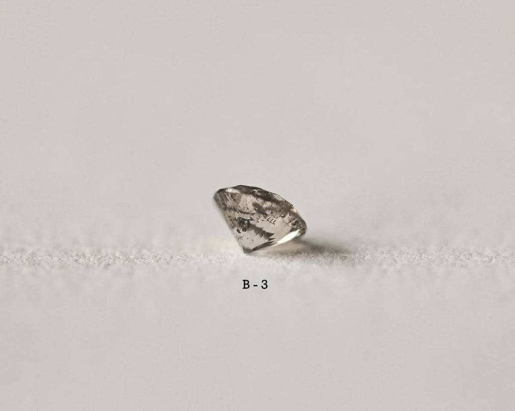 Raw diamond on a light gray background