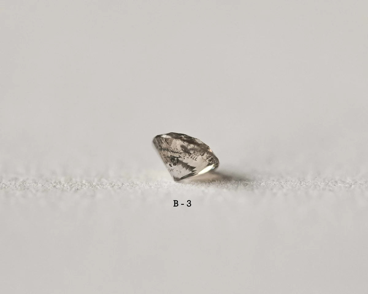 Raw diamond on a light gray background