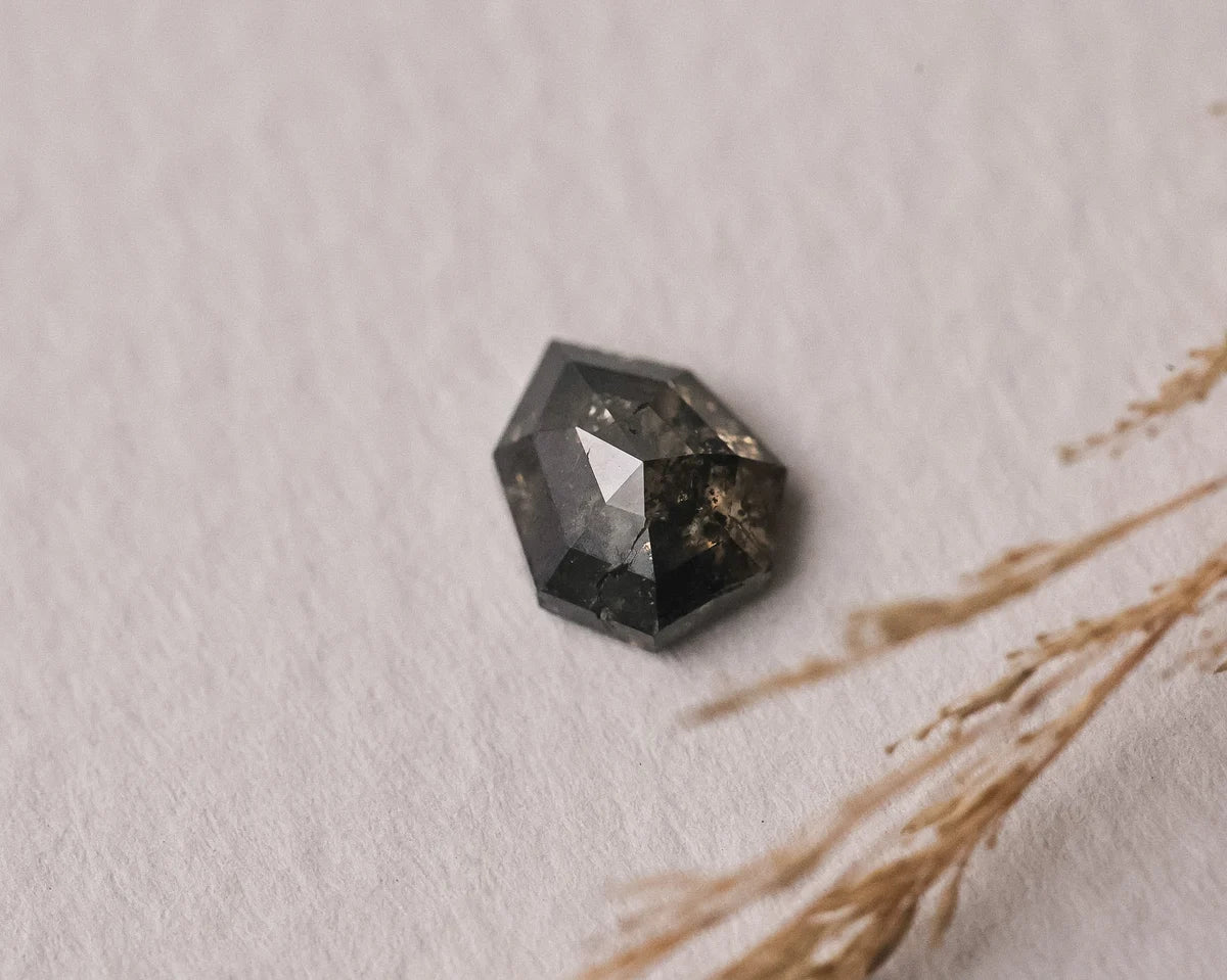 Loose grey hexagonal rose-cut diamond shown with botanical styling