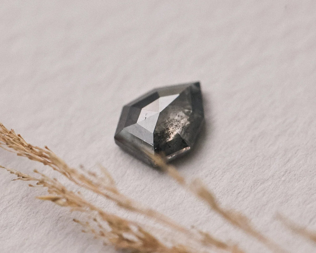  Angled close-up of grey rose-cut diamond showing faceted dome
