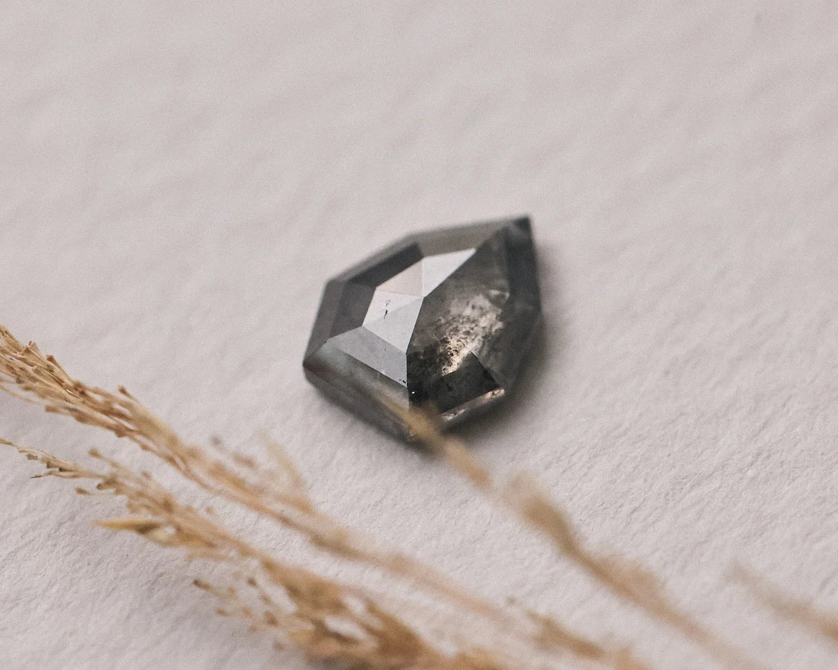  Angled close-up of grey rose-cut diamond showing faceted dome
