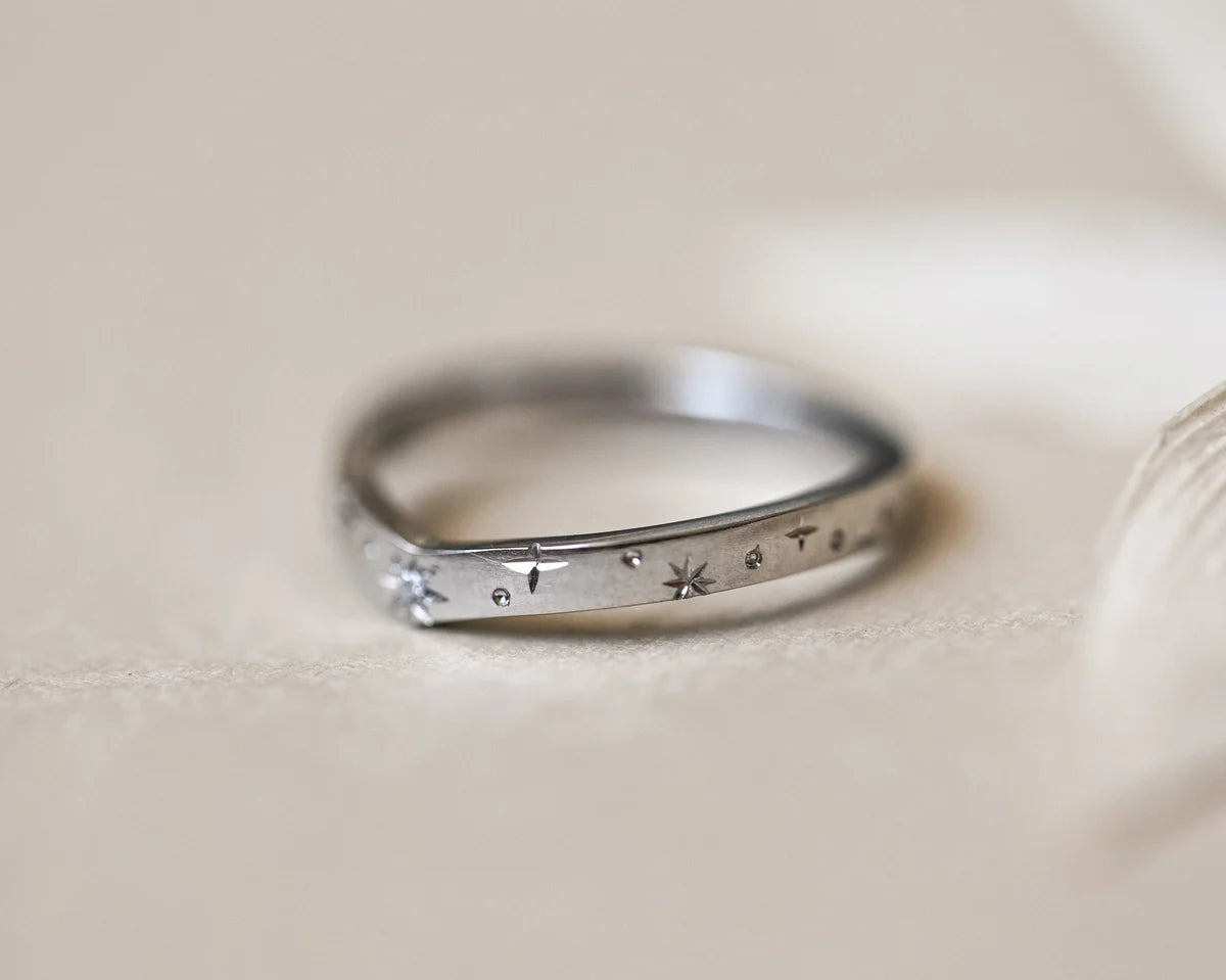 Low front view of 2mm platinum star set diamond wishbone ring
