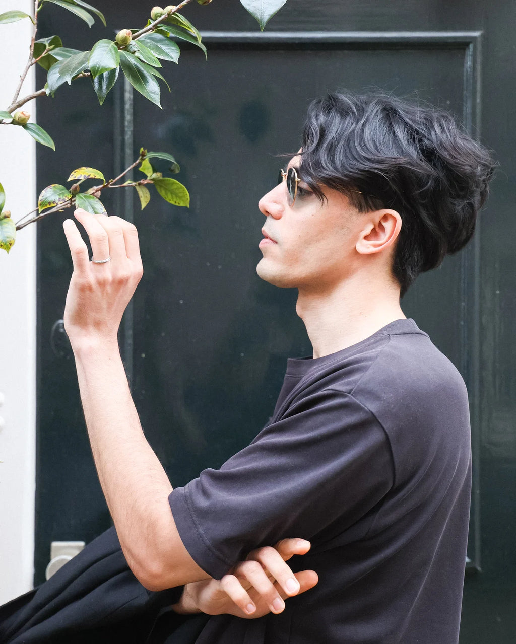 Platinum olive leaf ring worn in editorial lifestyle image