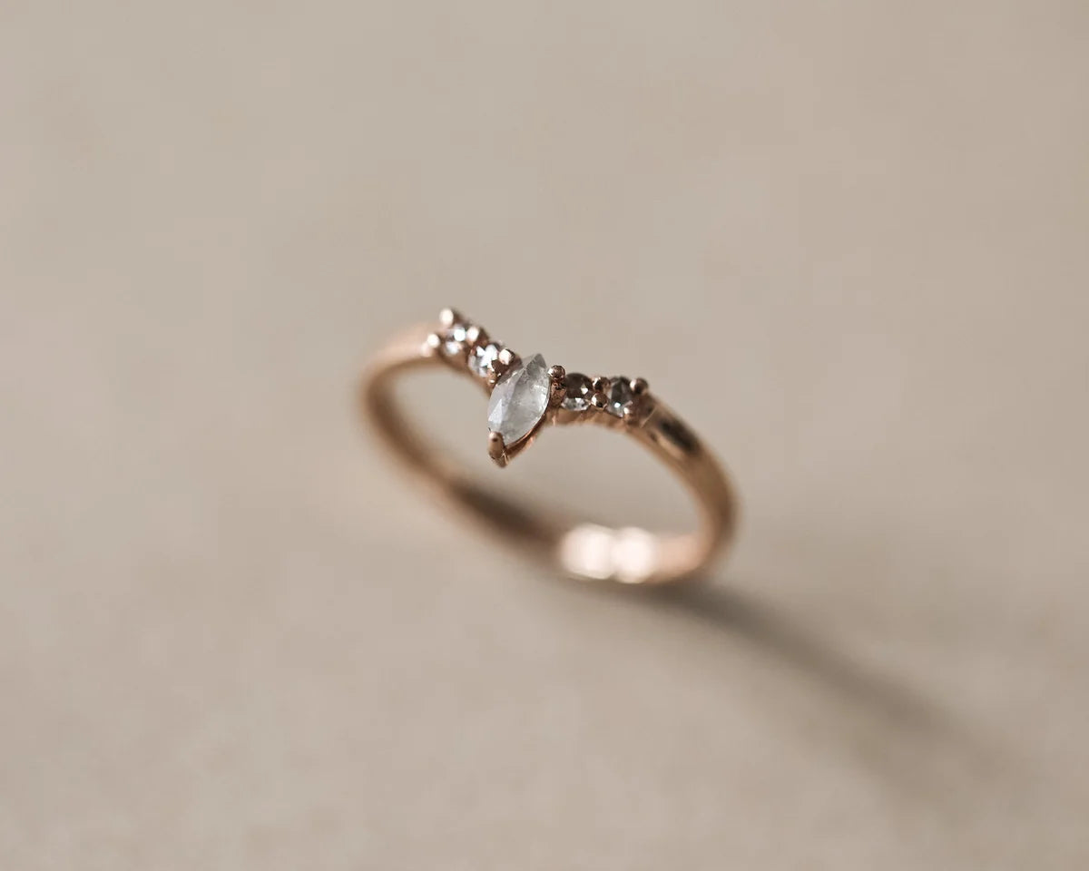 Side view of 18ct rose gold wishbone ring with natural diamonds