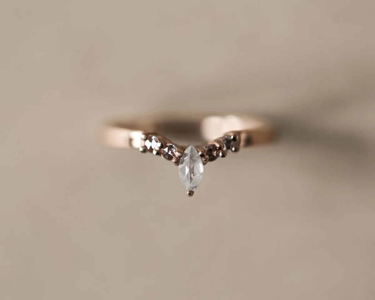 Front view of marquise diamond wishbone ring with rose-cut side diamonds