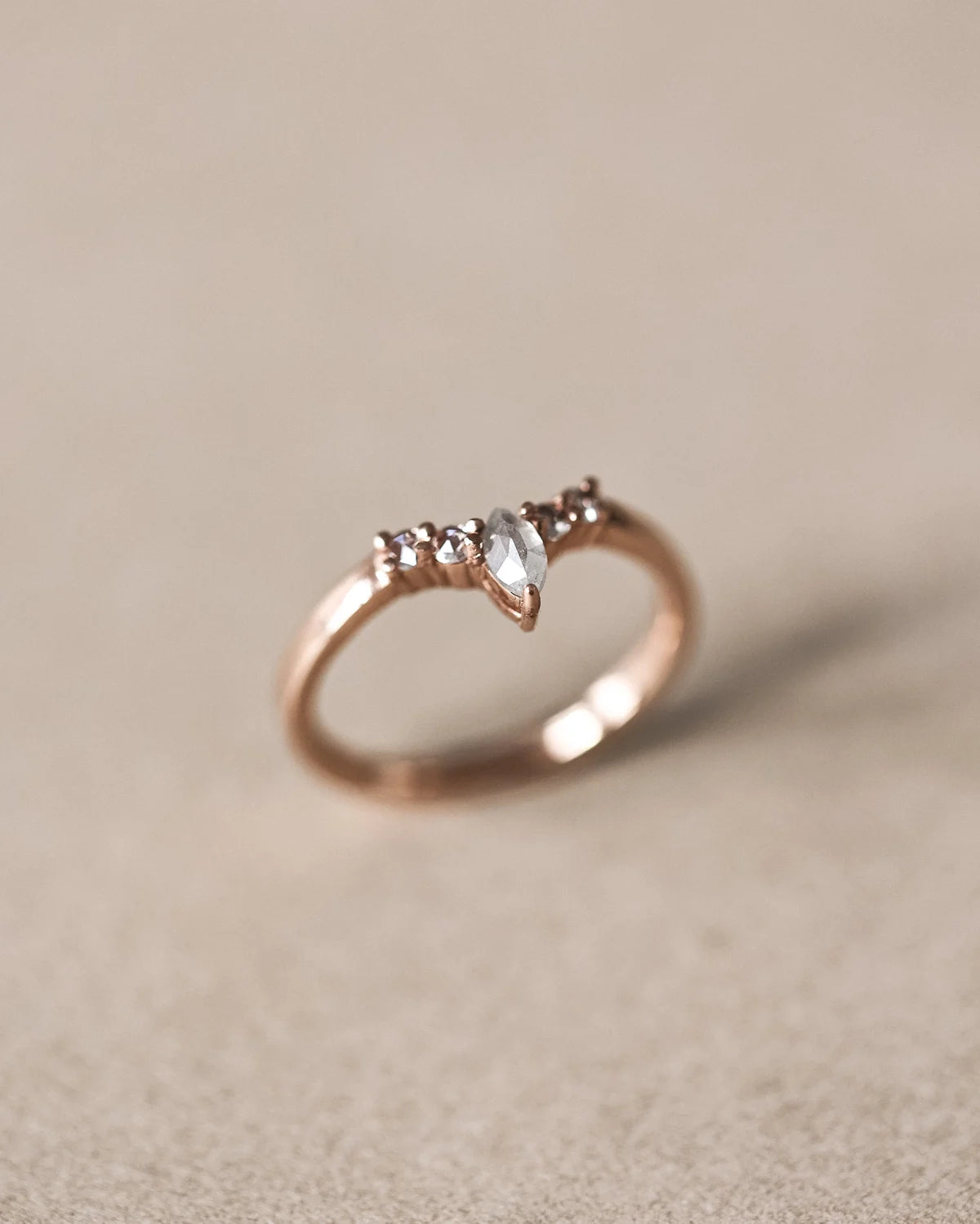 Front view of rose gold marquise diamond wishbone ring