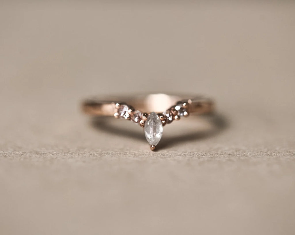 Low front view of milky grey marquise diamond wishbone ring