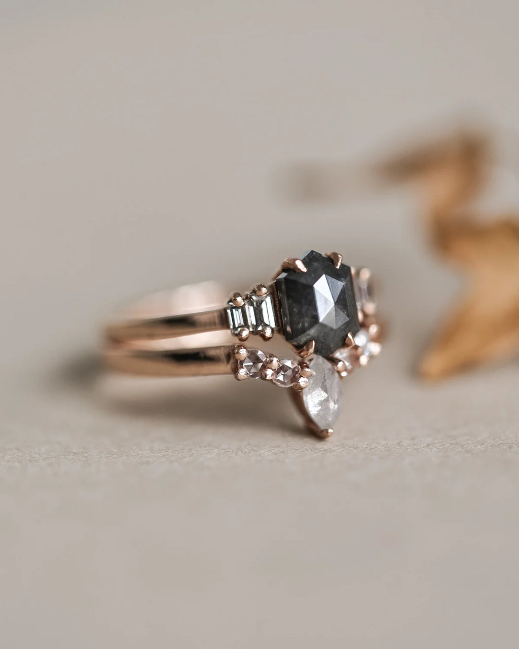 Detailed view of milky grey marquise diamond and rose-cut white diamonds