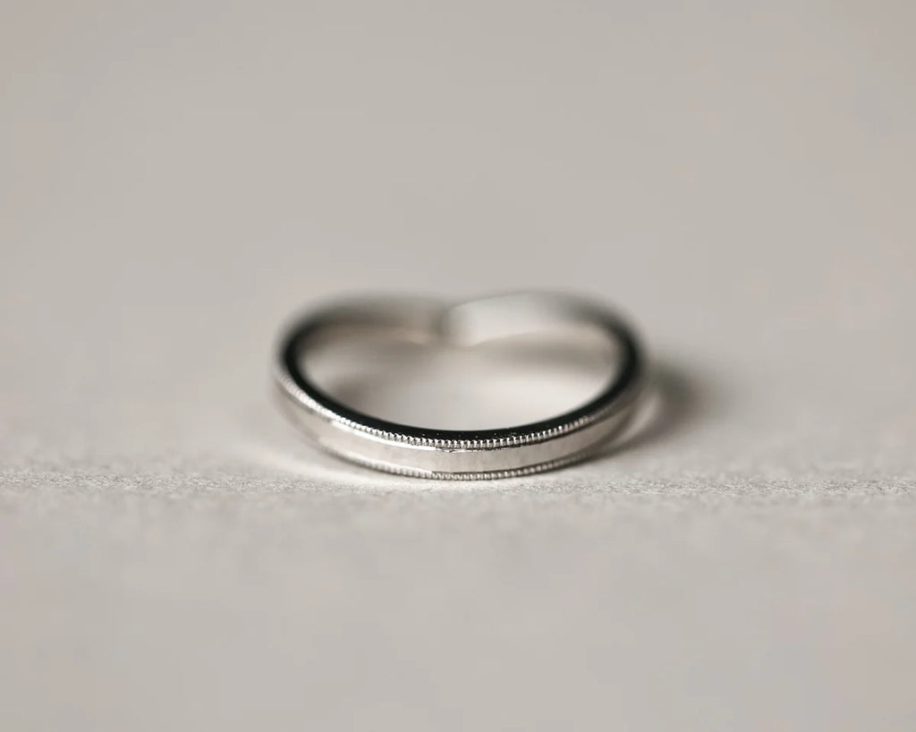 Back view of platinum wishbone wedding ring with smooth interior