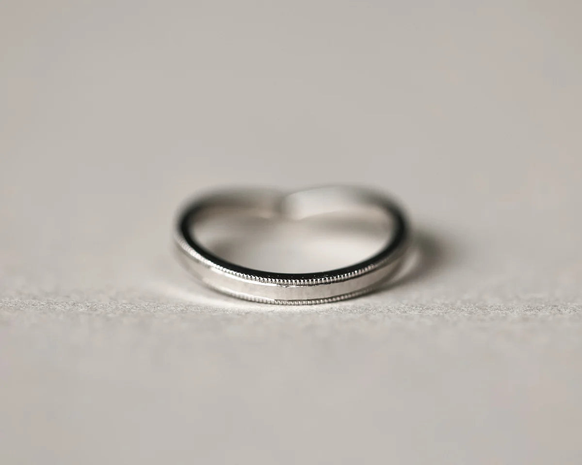 Back view of platinum wishbone wedding ring with smooth interior