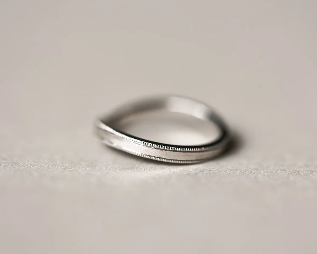 Minimal platinum milled edge wishbone wedding ring