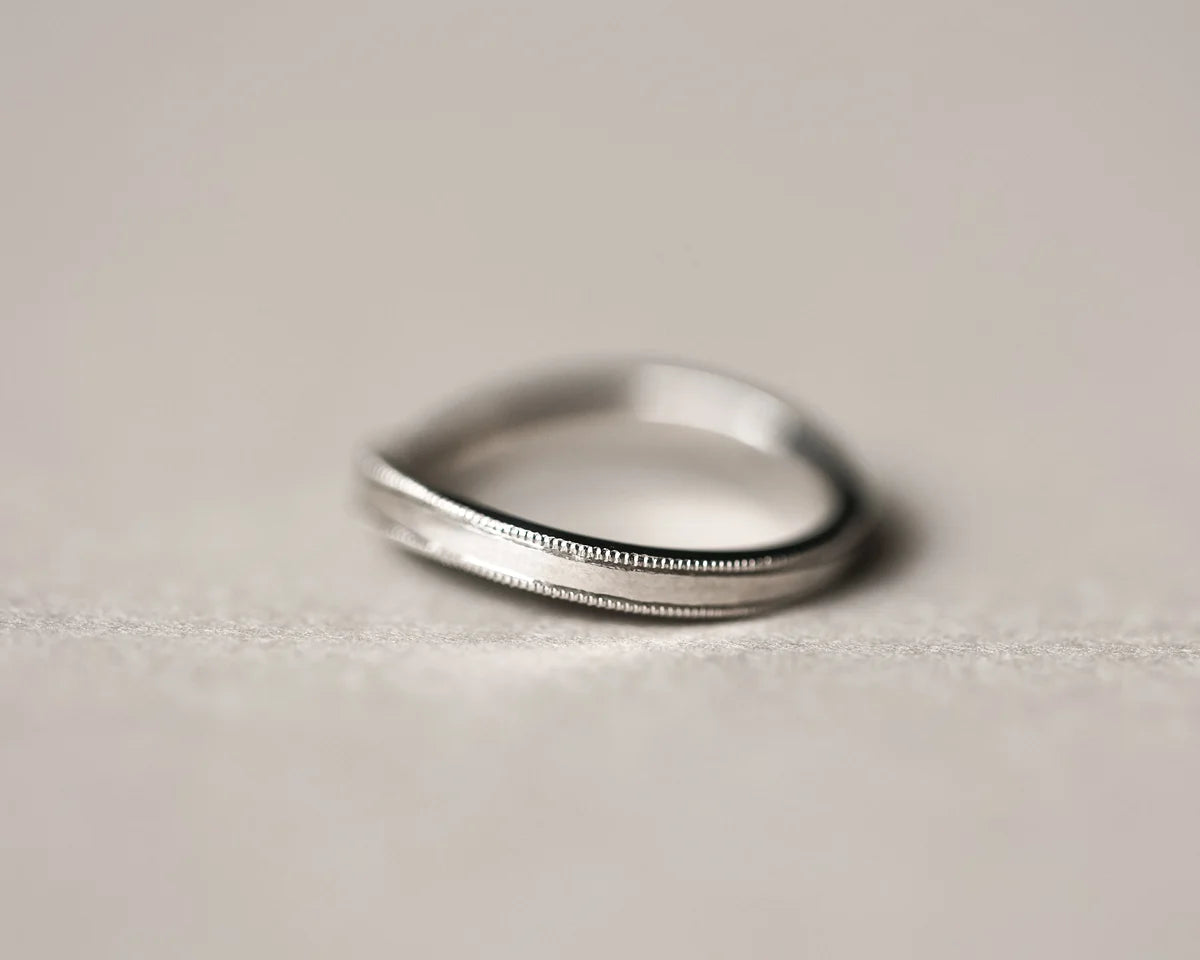 Minimal platinum milled edge wishbone wedding ring